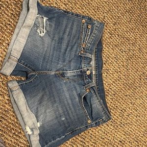 Levi’s distressed shorts.  Not cutoffs.  Minimal stretch.
